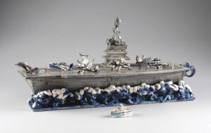 Gerry Wallace, "Aircraft Carrier" 2005. Stoneware, porcelain, 8.5 x 18.25 x 6.75 in. Kamm Collection 2005.84.1.