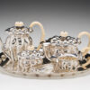 A tea set with teapot, cup and saucer on a tray.