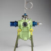 A green and blue fire hydrant with a hose attached.