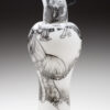A black and white vase with a bird on it
