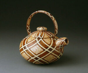 A wood teapot sculpture by Ray Feltz.