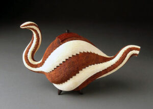 A wood teapot sculpture by William Smith.