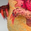 A close up of the feet and claws on a cake