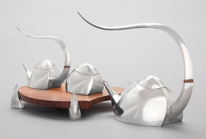 Michael and Maureen Banner, "Tales of Michaelman" 2008-2009. Sterling silver, rosewood, 9.5 x 10.5 x 4.5 in. (teapot). Kamm Collection 2014.89.7.